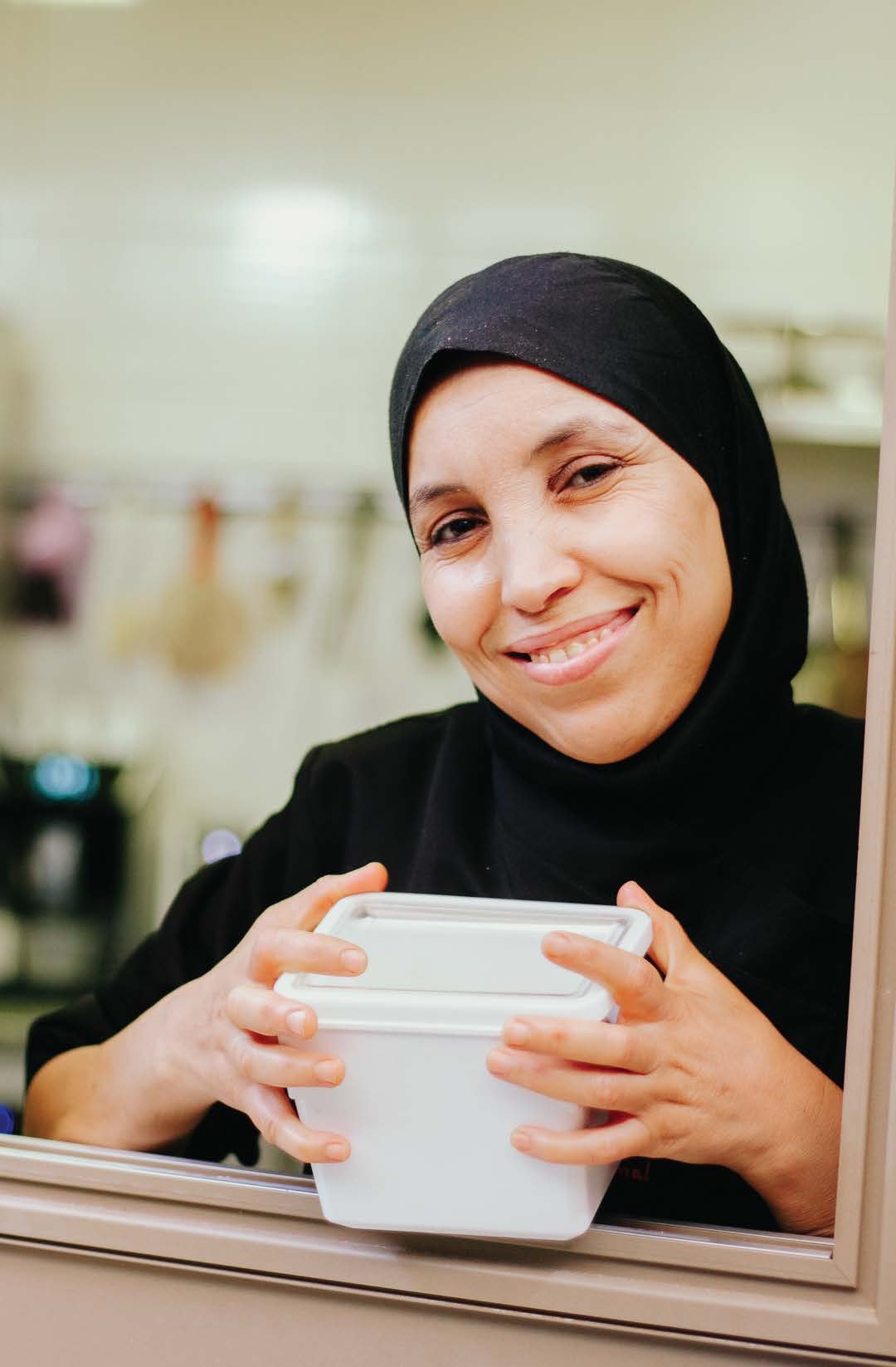 A server holding a cup at Sign Café Marrakech
