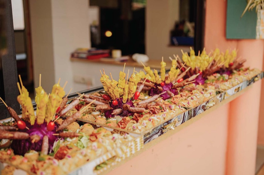 An Amal catering buffet of skewers and Moroccan platters