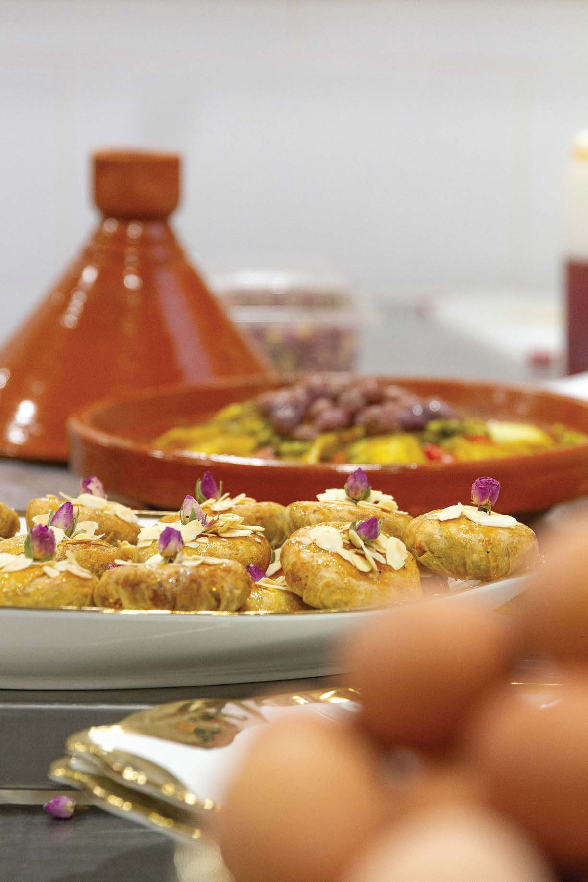 Golden Moroccan pastries beside a tagine