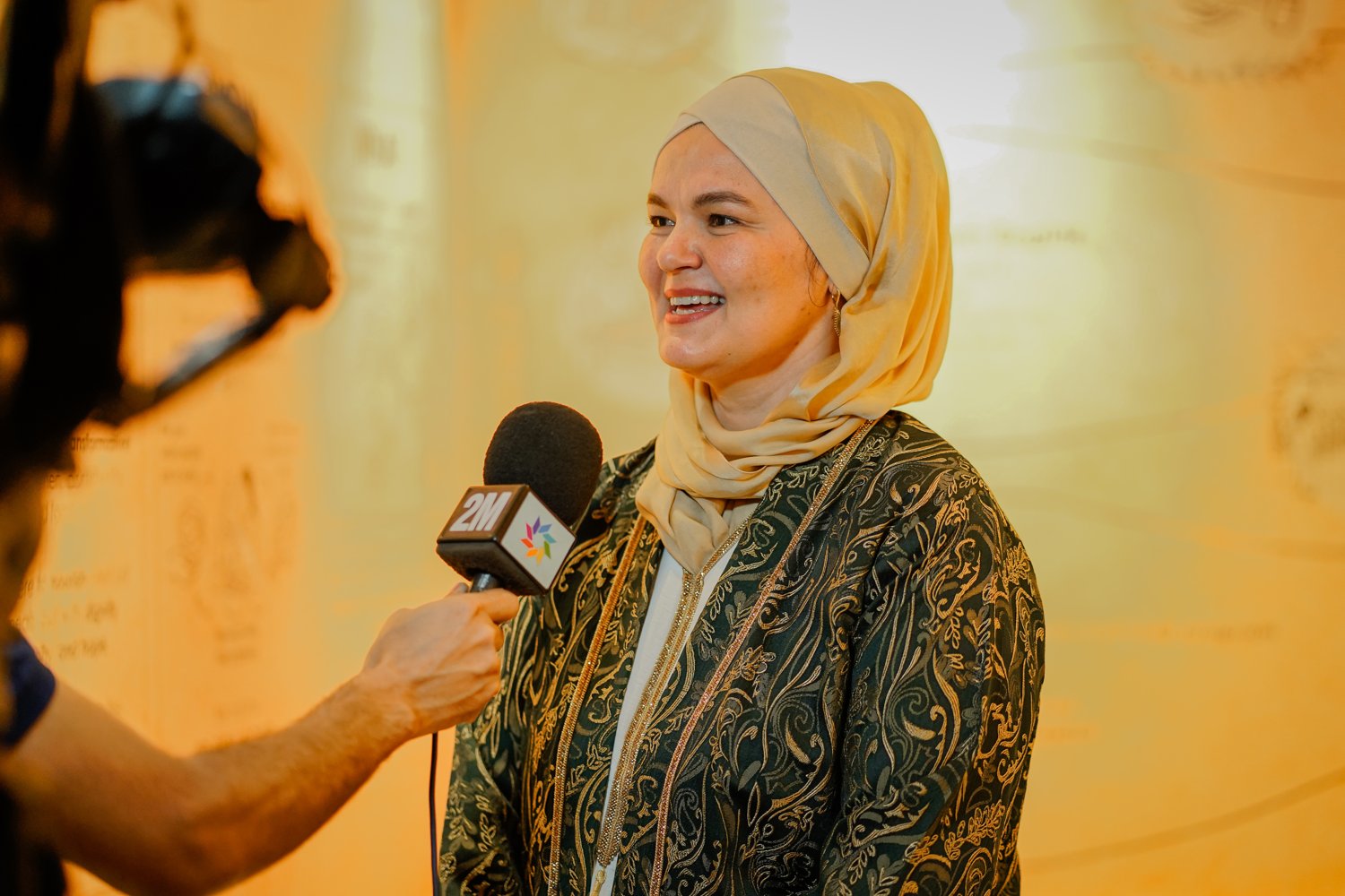 Nora Fitzgerald Belahcen, Amal's founder, speaking at an event