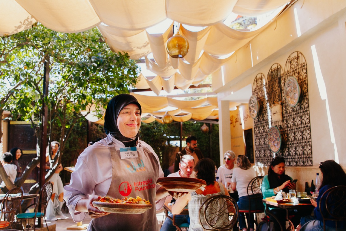 A couscous lunch served to guests in the Amal Gueliz garden