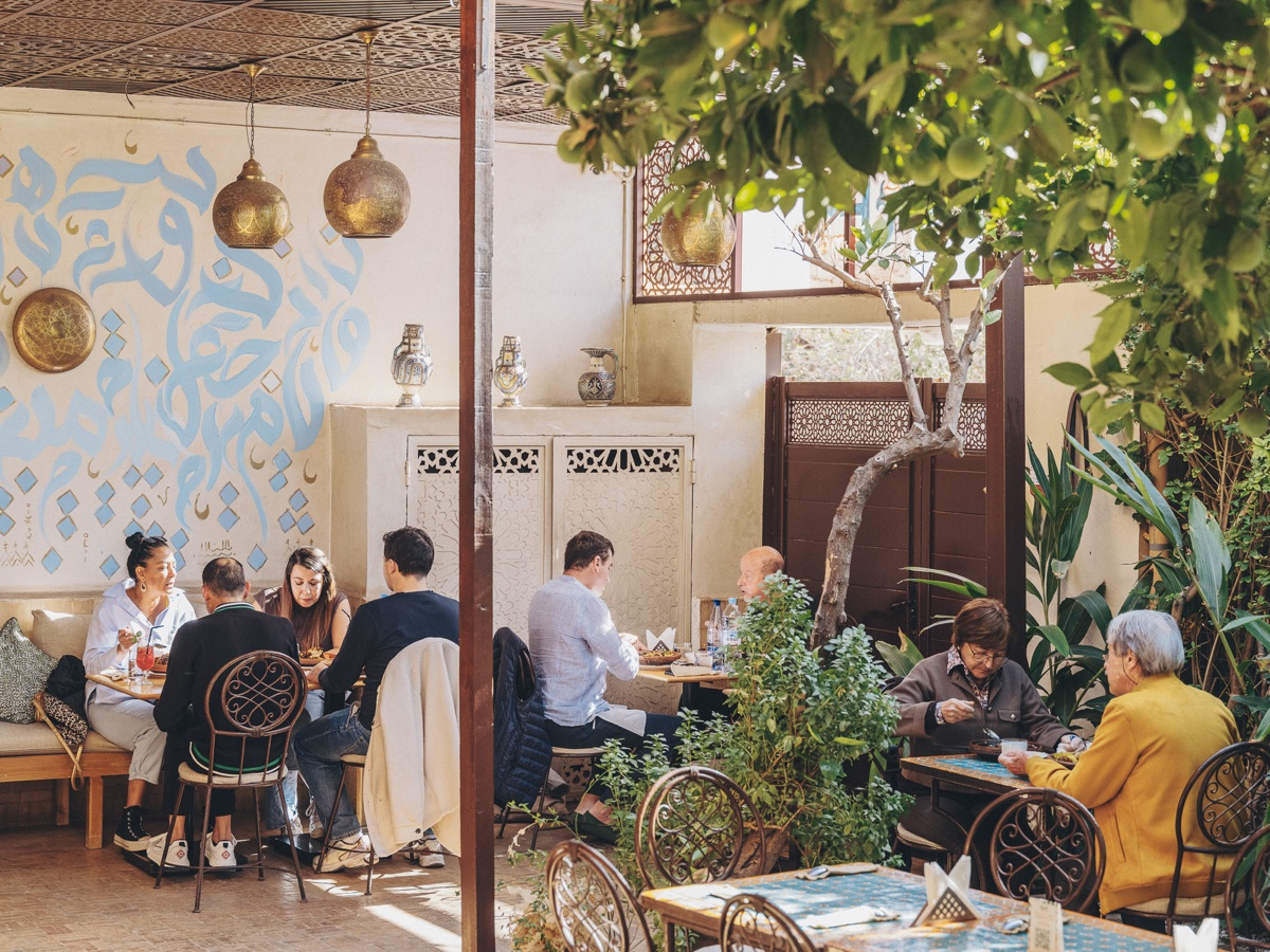 Guests dining at the Amal Gueliz restaurant
