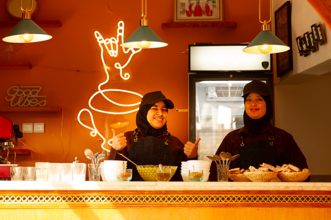 Staff behind the counter inside the Sign Café
