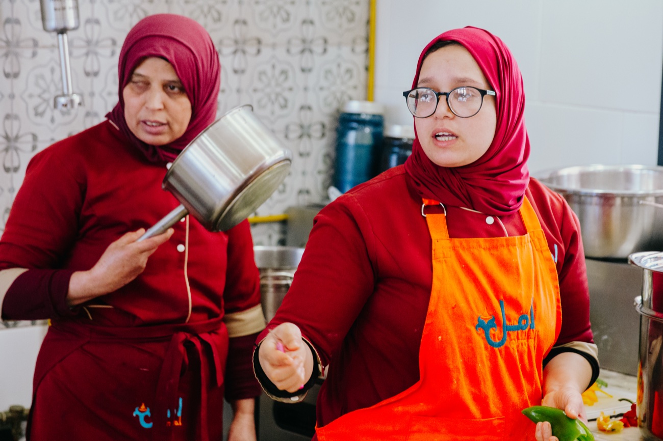 Two Amal chefs in the garden kitchen