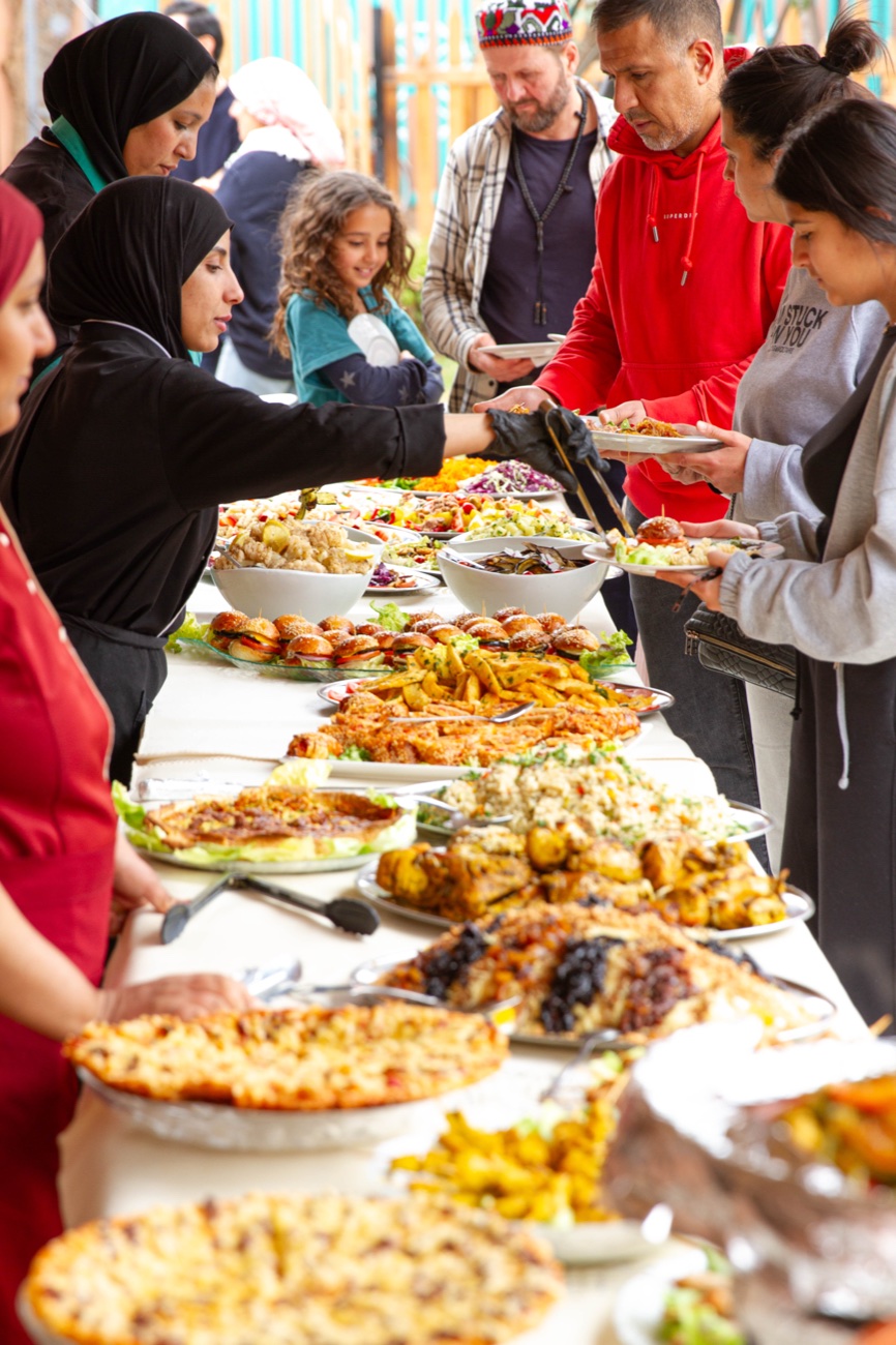 Guests at an Amal Targa buffet